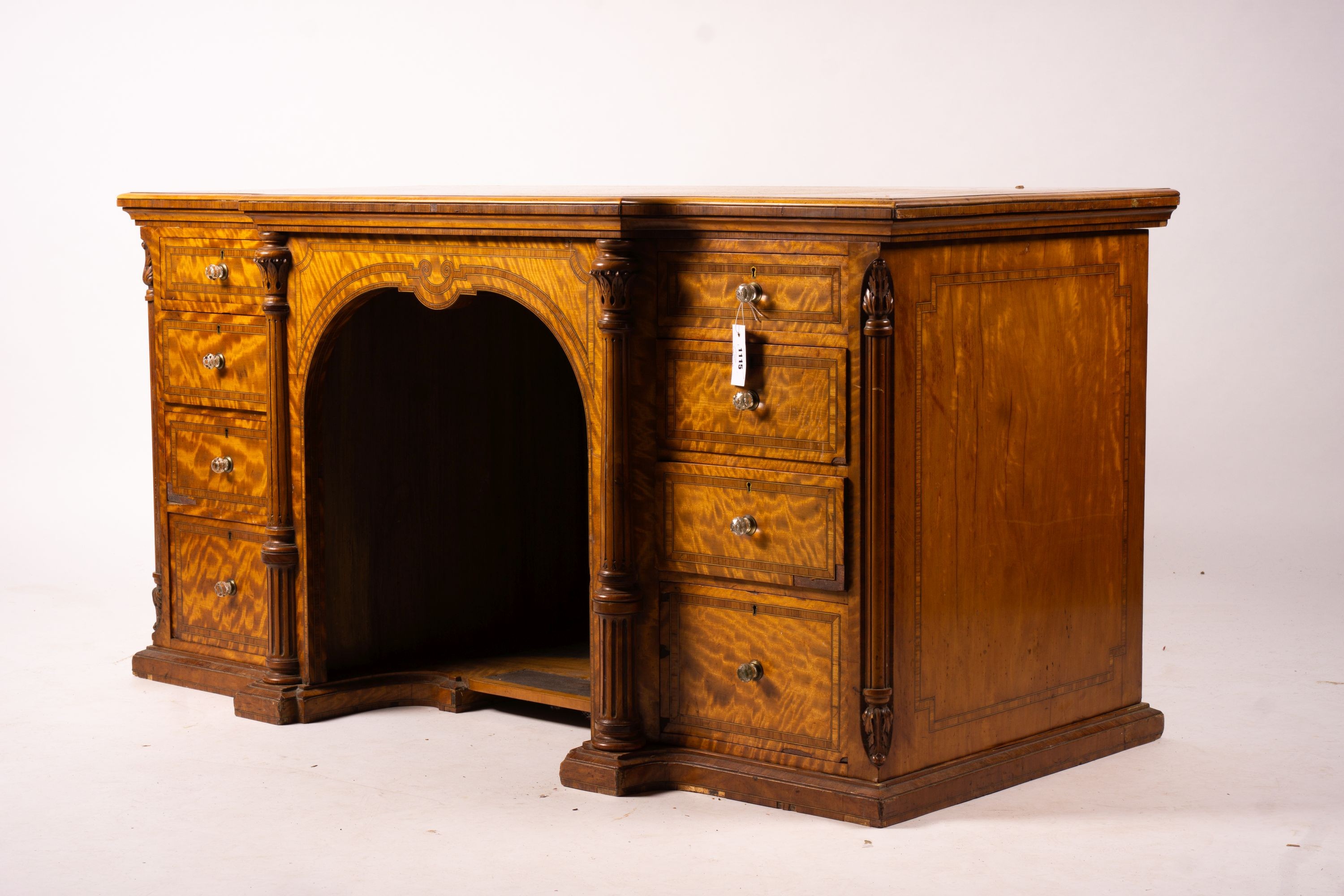 A late Victorian banded satinwood kneehole desk, width 138cm, depth 67cm, height 71cm